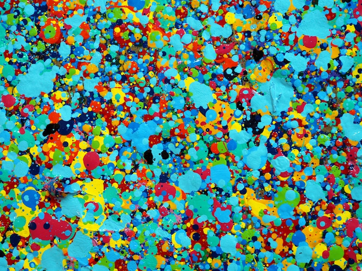 Photo peinture gouttes colorées texture. couleurs vives abstraites fond artistique éclaboussures.