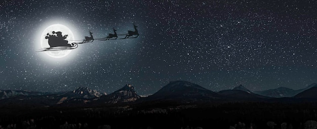 Photo un père noël vole sur le fond de la lune la veille de noël.