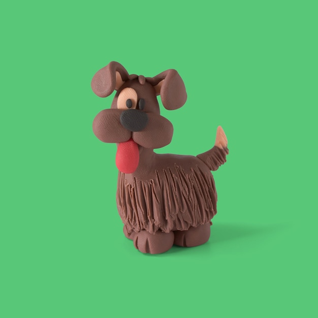 Petit chien assis en pâte à modeler marron fait à la main