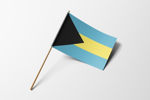 Petit drapeau en papier des Bahamas sur fond blanc