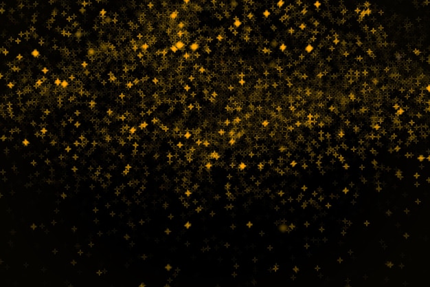 Les Petites étoiles Jaunes Et Dorées Brillantes Et Foncées Brouillent L'élément De Conception Noir Bokeh Pour La Superposition