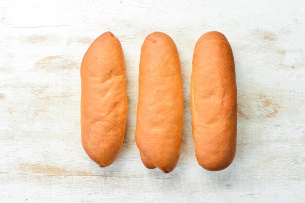 Petits pains frais de boulangerie pour hot-dogs Cuisson à partir de seigle et de farine Vue de dessus Style rustique