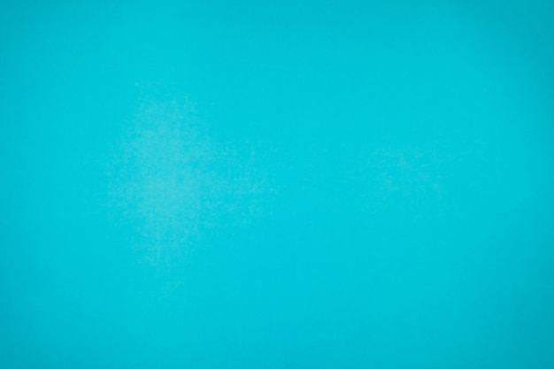 Un peu de papier turquoise bleu vif marbré uni et solide pour un fond d'objet minimal.