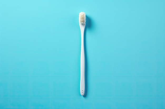 Une photo d'une brosse à dents se tenant seule sur un fond bleupg