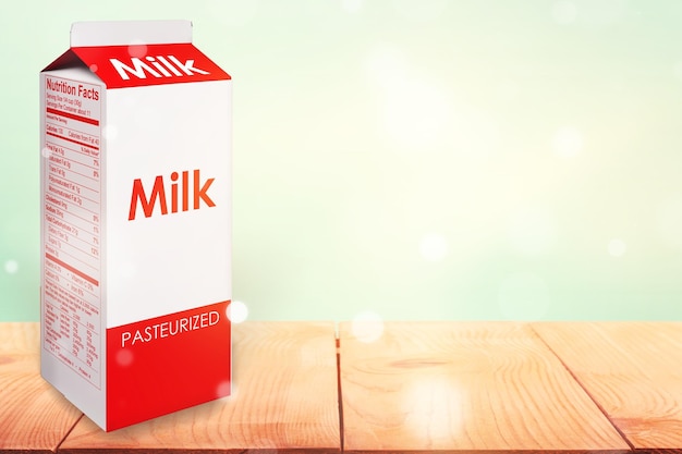 Une photo de carton de lait sur une table en bois