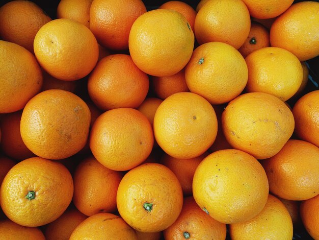 Photo une photo complète des fruits d'orange.