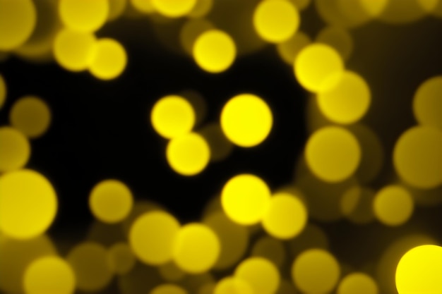 Photo fond panoramique sombre bokeh jaune vif cercles lumineux vague abstraite