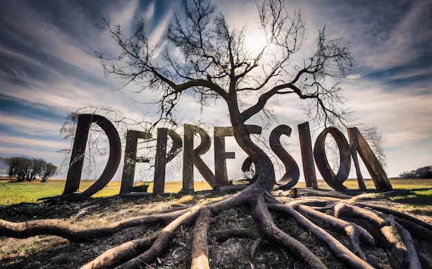 Photo une photo en noir et blanc d'un arbre avec le mot dépression écrit en noir.