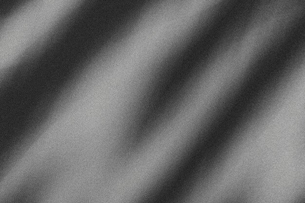 Photo une photo en noir et blanc d'une surface brillante avec un fond noir et blanc