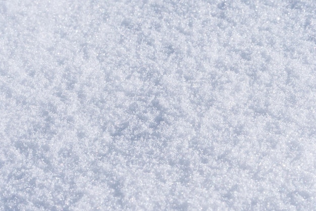 Photo une photo prise en gros plan de la texture de la neige fraîche à la lumière naturelle