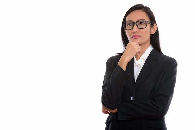 Photo de Studio de belle jeune femme d'affaires asiatique