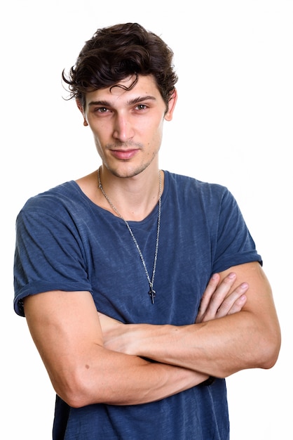 Photo de Studio de jeune beau avec les bras croisés