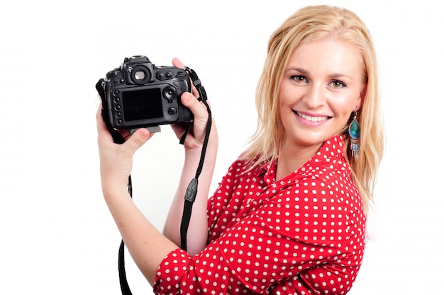 Photographe jolie femme blonde avec caméra