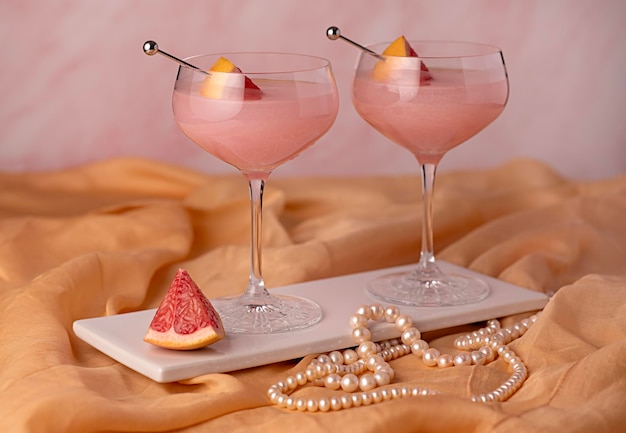 Photographie de cocktail de pamplemousse boisson cocktail élégance bijoux perles perles roses célébration