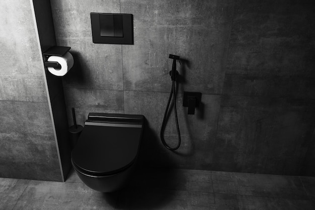 Photographie de détails de salle de bain noir mat avec des murs gris foncé