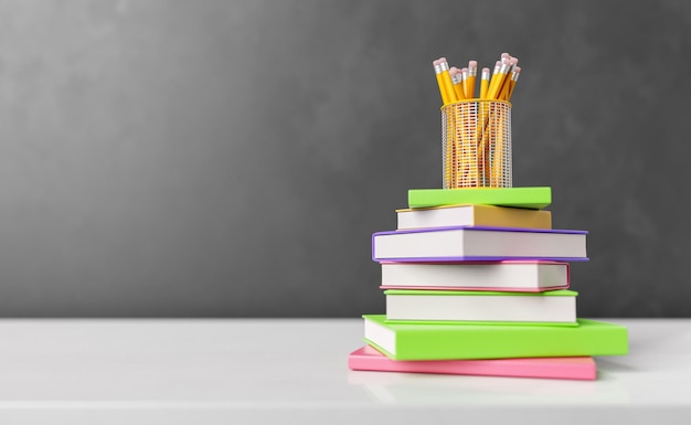 Pile de livres délimités colorés sur tableau blanc avec des crayons