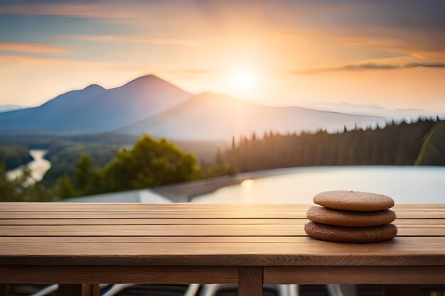 Une pile de pierres sur une table en bois avec une montagne en arrière-plan