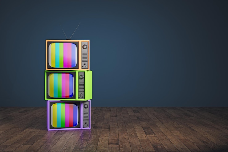 Photo pile de télévision arc-en-ciel obsolète
