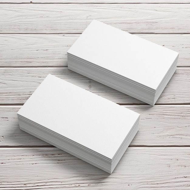 Des piles de cartes de visite vierges blanches sur une table en bois. Rendu 3D
