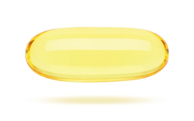 Pilules jaunes sur blanc