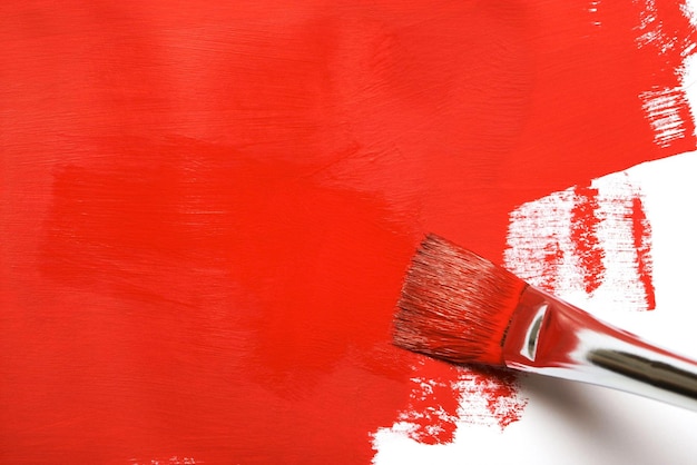 Photo un pinceau de peinture rouge