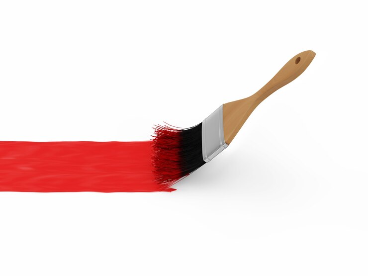 Photo pinceau avec trait de peinture rouge isolé sur blanc