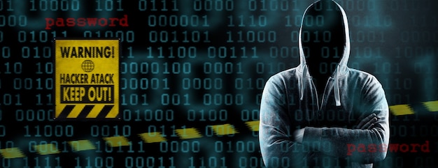 Photo un pirate imprime un code sur le clavier d'un ordinateur portable pour s'introduire dans un cyberespace