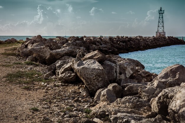 Photo plage avec phare