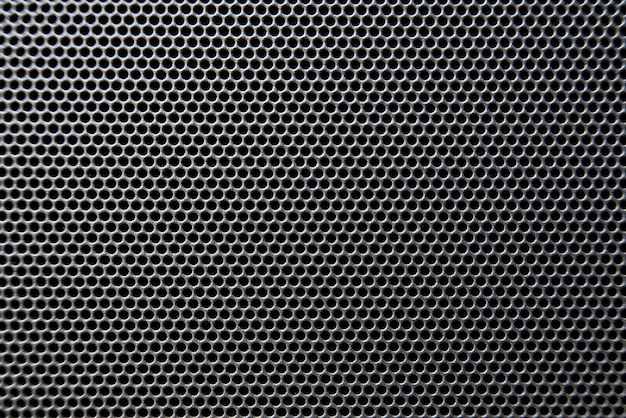 Plan macro sur le détail de la grille du haut-parleur, la texture de la grille du haut-parleur