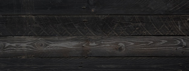 Planche de bois brut noir