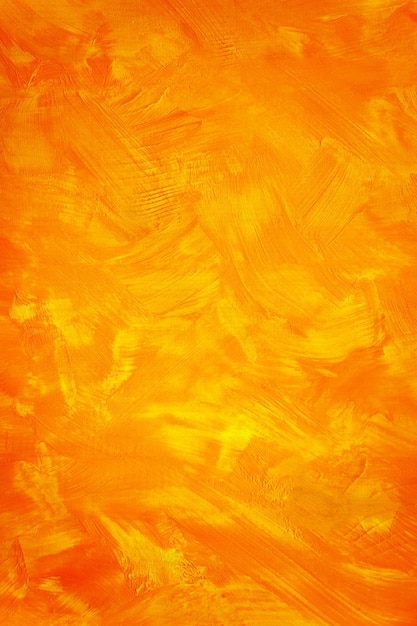 Planches en bois brossées avec de la peinture acrylique jaune orange vif Texture de fond d'art de couleur saturée