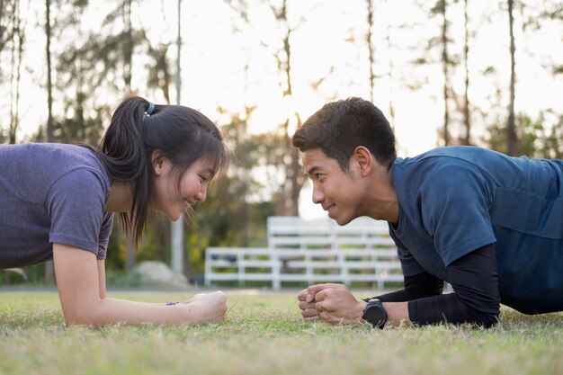 Planking couple sport fitness.