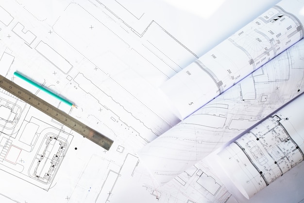 Photo plans architecturaux sur une table close up