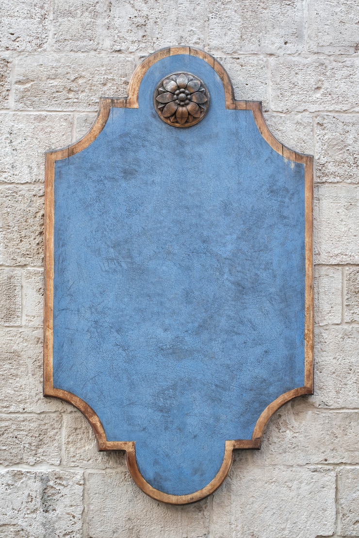Photo plaque bleue figurée sur un mur de briques