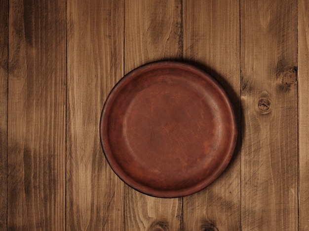 Plaque sur une table en bois - vue de dessus