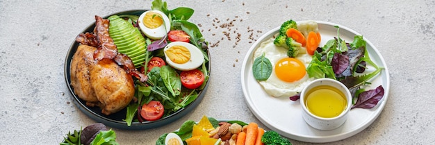 Photo plaques de légumes avec viande, poisson et œufs régime complet pour la journée