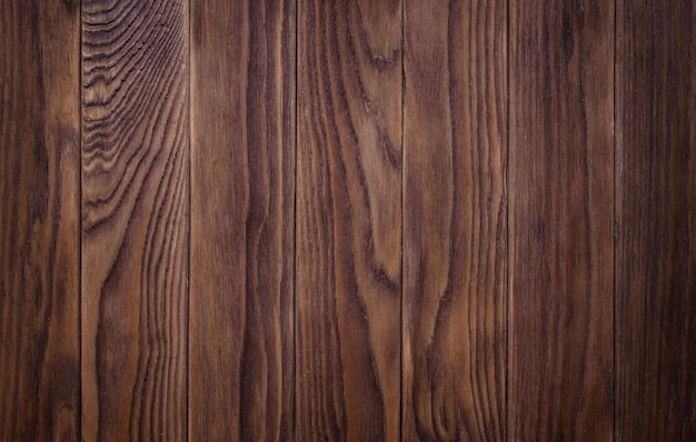 Pleine page de texture de planche de parquet en bois sombre taché, en détresse