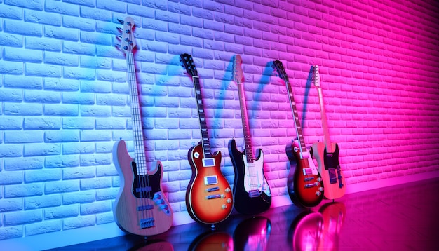 Plusieurs guitares électriques contre un mur de briques en néon, illustration 3d