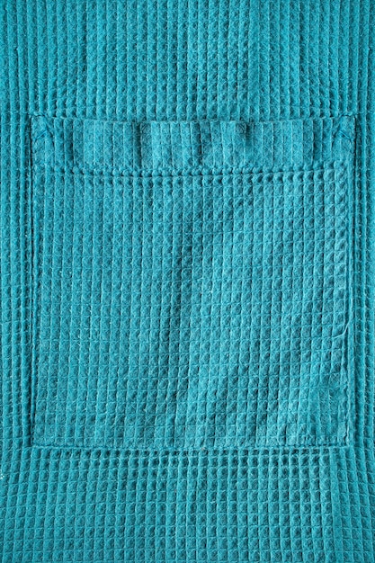 Poche à vêtements en tissu gaufré en coton bleu comme arrière-plan