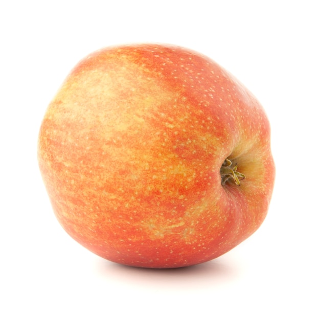 Pomme rouge sur fond blanc avec une ombre.