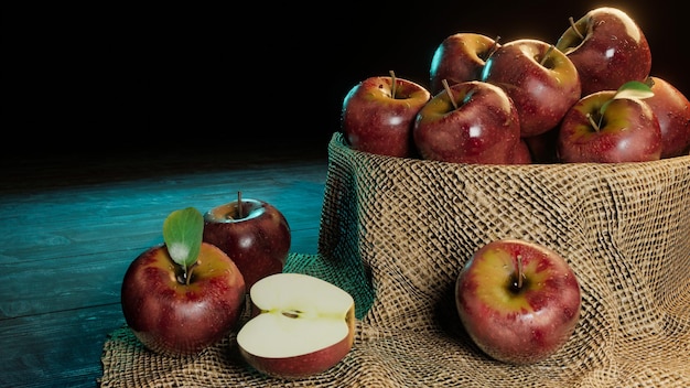 Pommes dans un bol qui recouvrent de tissu sur du bois dans des conditions de faible luminosité Concept Apple par jour éloigne le médecin