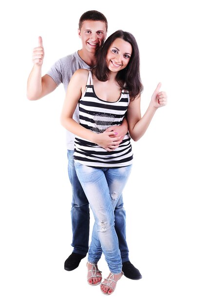 Portrait d'un beau jeune couple souriant heureux pouce vers le haut