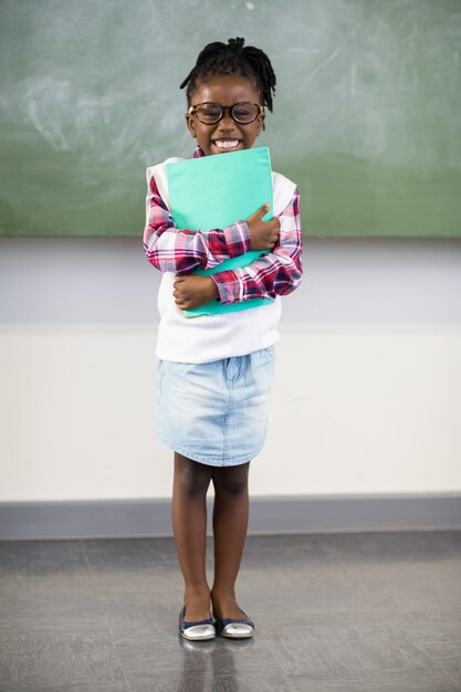 Photo portrait, heureux, écolière, tenue, fichier, classe