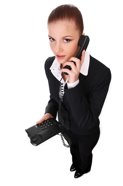 Portrait de jeune femme d'affaires avec téléphone noir