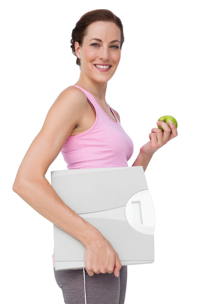 Portrait d&#39;une jeune femme avec une balance et une pomme