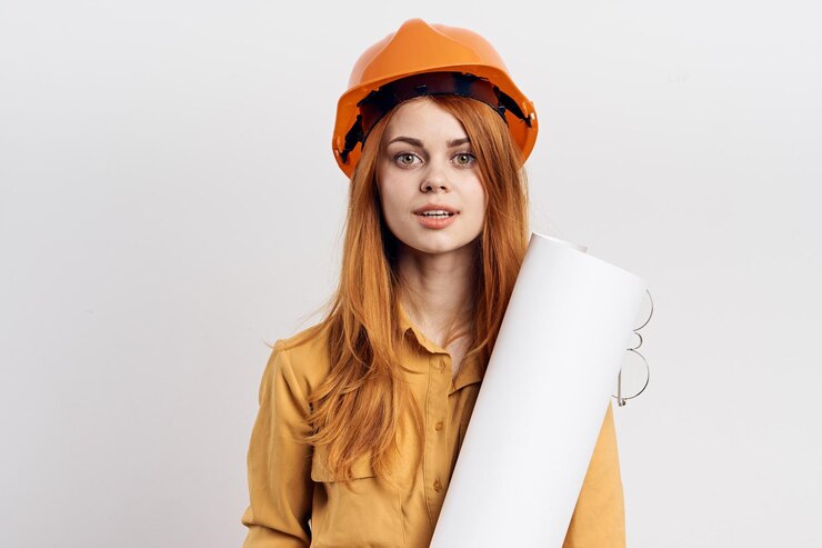 Photo portrait d'une jeune femme souriante portant un chapeau sur un fond blanc