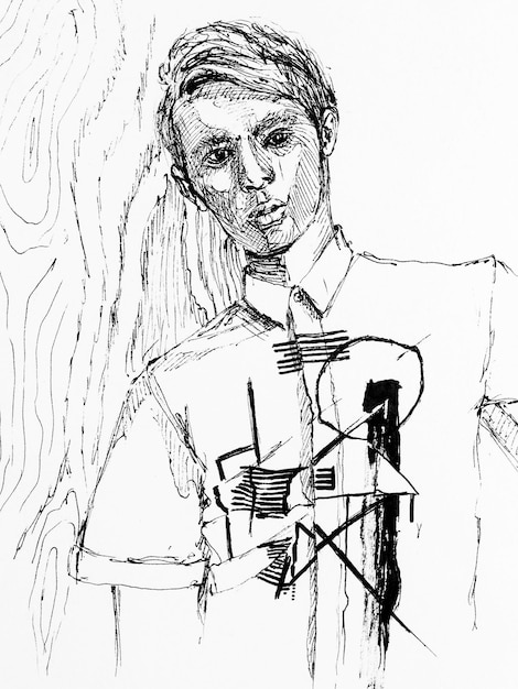 Photo portrait d'un jeune homme dessinant à la main à l'encre noire sur papier œuvre d'art en noir et blanc