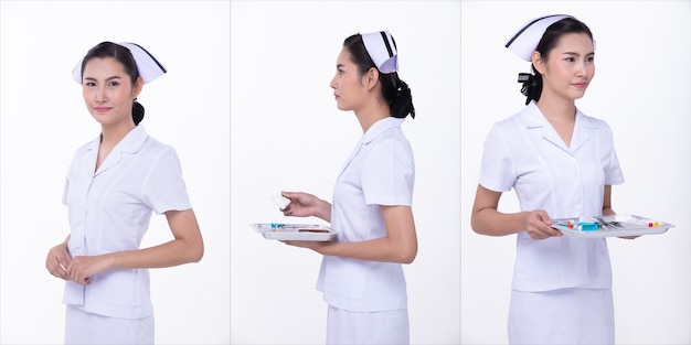 Portrait de la moitié du corps d'une femme asiatique des années 20 portant un uniforme d'infirmière blanche. Plateau de prise femelle et pose sur fond blanc isolé