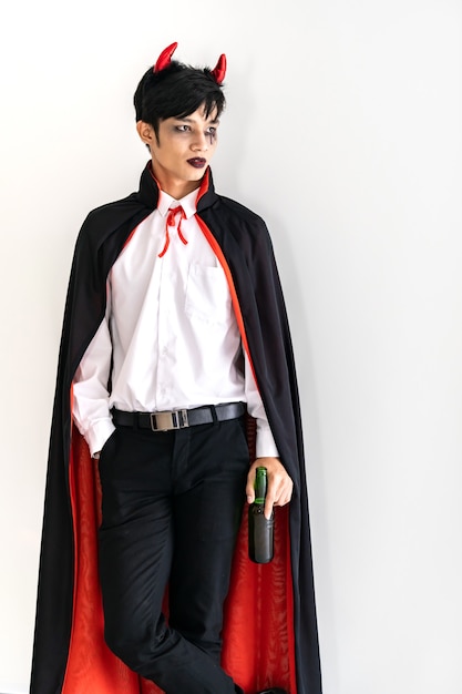 Portrait of Asian young adult teenage man wearing costume d'Halloween en tissu