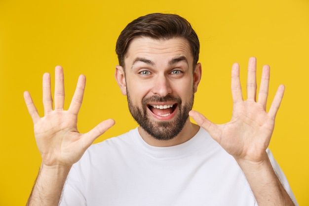 Portrait of happy friendly brown-haired man with small beard in white shirt